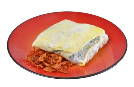Vietnamese rice noodle rolls with a filling of pork sliced and egg ,  fried onion on red dishの写真素材