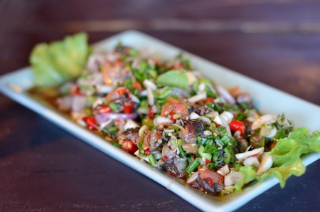Spicy cockle salad  with fresh vegetable , Thai style seafoodの写真素材
