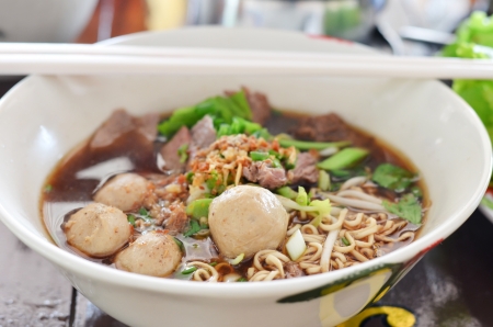 Instant noodles and  meatball  with chopsticks , asian noodleの写真素材