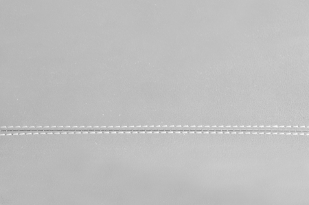 gray  horizontal stitched leather background  
の写真素材