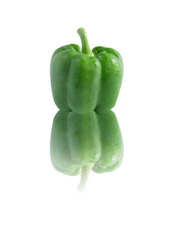 green  sweet  pepper over  white background  with reflectionの写真素材