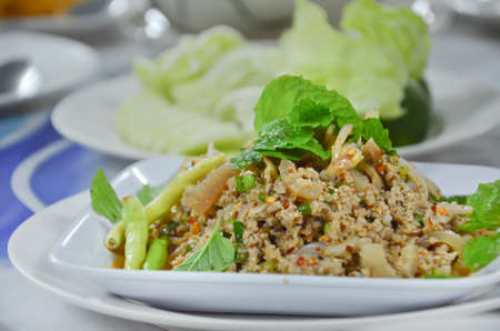 spicy minced pork eaten with vegetable , thai spicy foodの写真素材