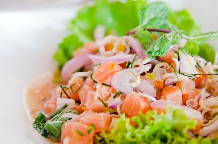 close up of spicy salmon salad with  mixed  vegetableの写真素材