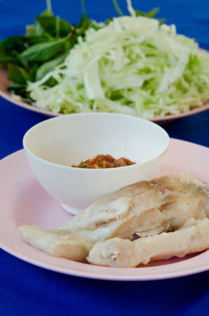  fresh steam fish served with chili sauce and vegetableの写真素材