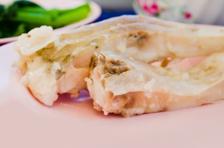 close up  fresh steam fish on pink dishの写真素材