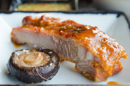 pork spare ribs with red sauce and mushroomの写真素材