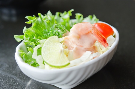 close up vegetable  salad with  shrimp  ,fresh  vegetable and white cream sauce , white bowlの写真素材