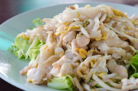 Fried Noodles with Chicken and vegetable on dishの写真素材