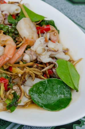 close up  stir fried   squid  and shrimp  with mix herbal on dishの写真素材