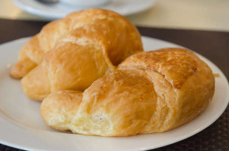 close up croissants on white plate , delicious bread for morning 