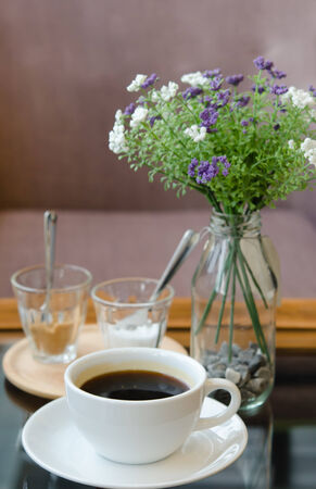Cup of Black Coffee with sugar and imitation creamの写真素材