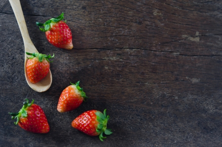 still life fresh strawberries  with spoon over  wooden の写真素材