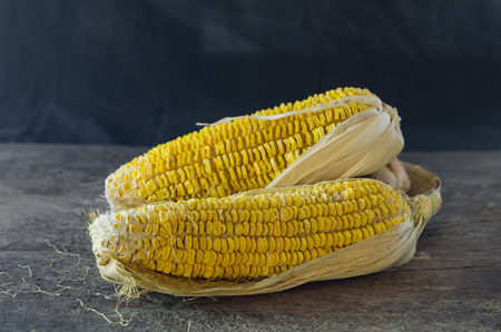 Dried corn  on an old wooden background