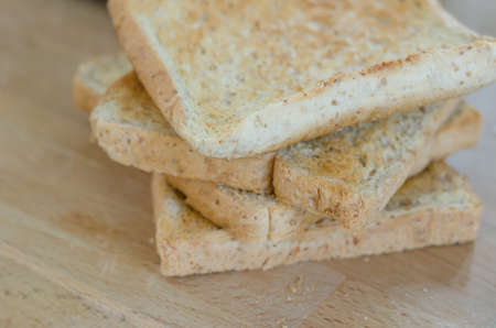 close up of slice toast bread on wooden boardの写真素材