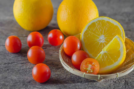Red cherry tomatoes  and orange