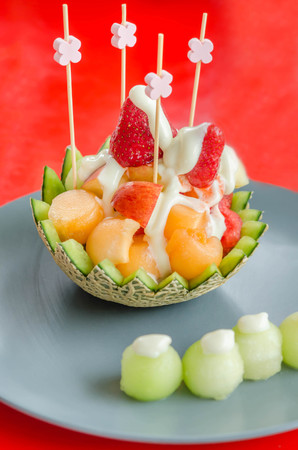Fresh Fruit Salad in Cantaloupe Bowl on dishの写真素材
