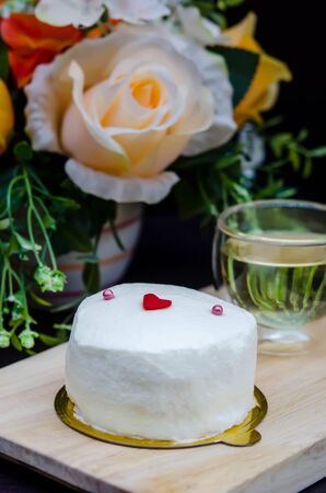 Homemade Coconut cream cake on wooden plateの写真素材