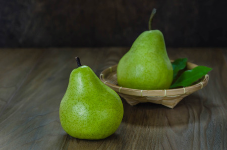 Fresh pears on the wooden background. Still lifeの写真素材