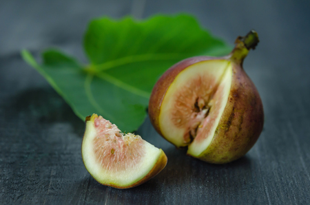 Portion of fresh Figs on wooden backgroundの写真素材