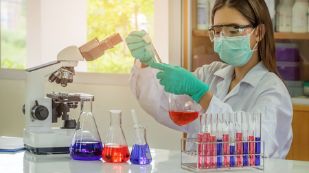 Portrait of Asian scientific researcher working in laboratoryの写真素材