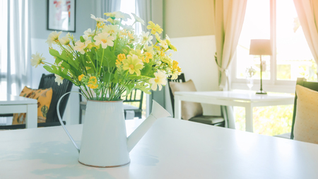 A bouquet of artificial flowers in potの写真素材