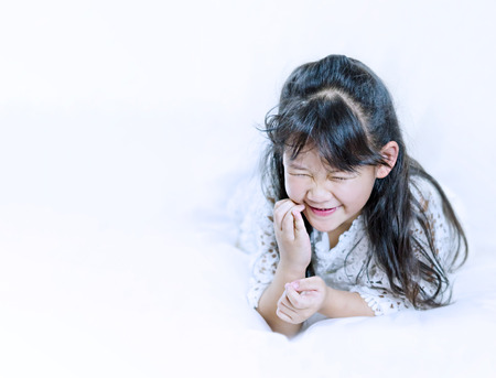 portrait of asian little  girl with white dressの写真素材