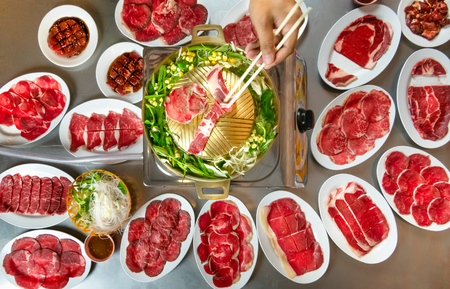Asian BBQ-Style. Grill sliced beef on hot pan with vegetableの写真素材
