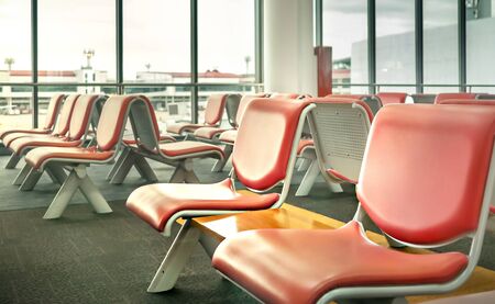 Empty seats in the departure lounge at the airportの写真素材