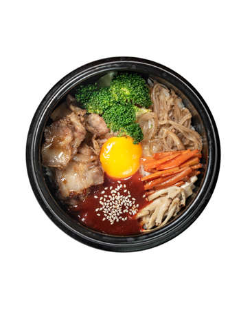 top view traditional korean style cuisine on white background . bibimbap: rice with vegetables and beefの写真素材