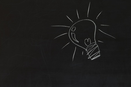 idea bulb on blackboard background の写真素材