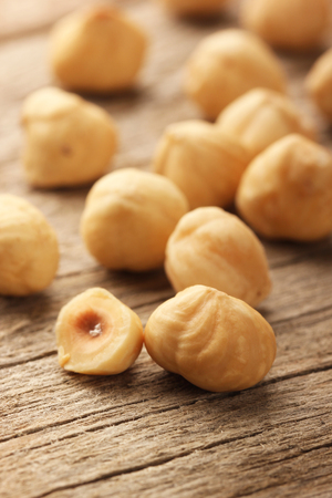 Hazelnuts on wooden tableの写真素材