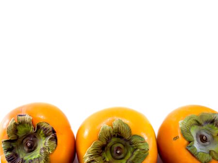 Isolated persimmon fruit on the white backgroundの写真素材