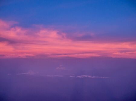 ariel view of clouds and sky in sunset above city background