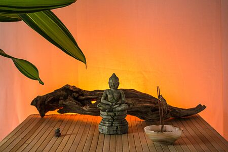 Buddha statue with incense