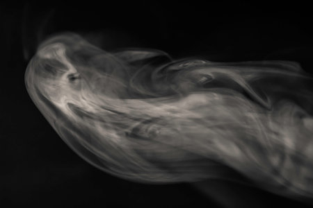 Cloud of smoke on a black backgroundの写真素材