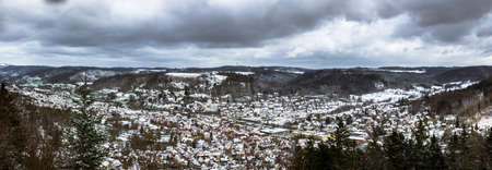 Snow over the roofs of the small town of Murrhardt in the Swabian-Franconian Forestの写真素材