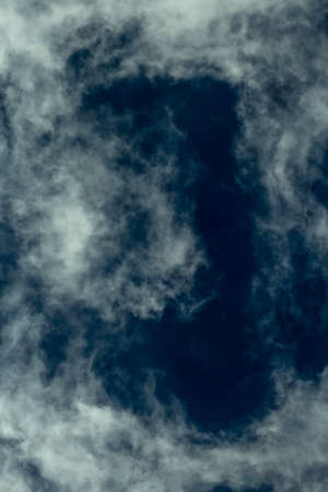 Abstract cloud structures on blue skyの写真素材