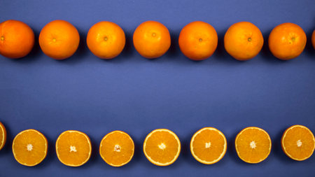 Oranges on a colored backgroundの写真素材