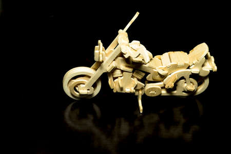 wooden motor on black backgroundの写真素材