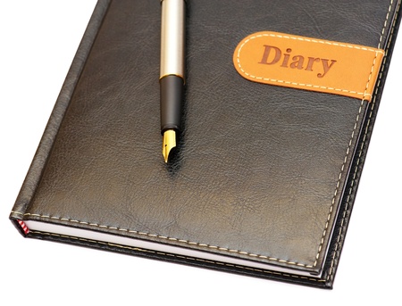 Isolated the gold pen and a leather diaryの写真素材