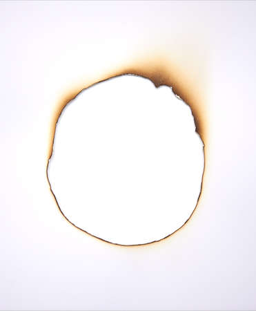 Burned hole within paper  Grunge frame with scorched edges  High resolution の写真素材