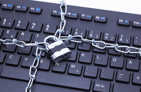 Image shows a keyboard with chain and lock