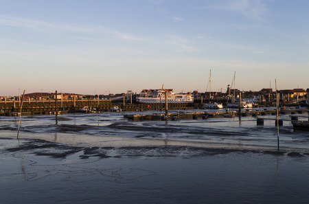 Image shows the habor of Jiust at low tide