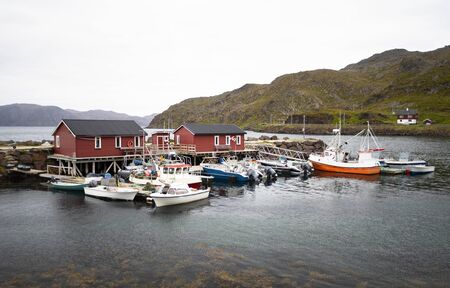 A small harbor with Fishing and sports boats in Northern Norwayの写真素材
