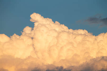 The photo shows a dramatically cloud formation in the sunset