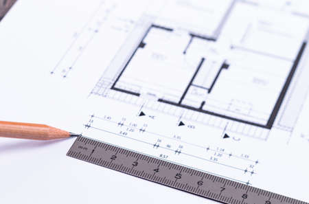 The photo shows an ExposÃ© with pencil and steel rulerの写真素材