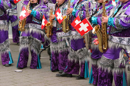 swiss musician combo playing next to the skiing track at the first worldcup cross country skiing event in the actual season 2007/2008 in Duesseldorf Germanyの写真素材