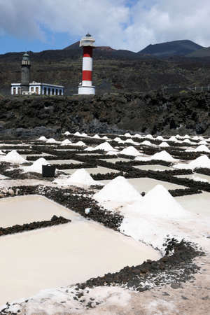Canary island saline with lighthouses and volcanoes in the backgroundの写真素材