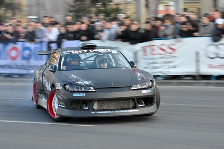 BRASOV, ROMANIA - APRIL 9: Gabriel Onofrei performing a drift show in the opening of TESS Rally 2011のeditorial素材