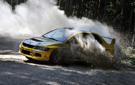 BRASOV, ROMANIA - AUGUST 28 2010: Popa Octavian and Beldie Mihaela driving a Mitsubishi EVO 9 at Tara Barsei Rally 2010のeditorial素材